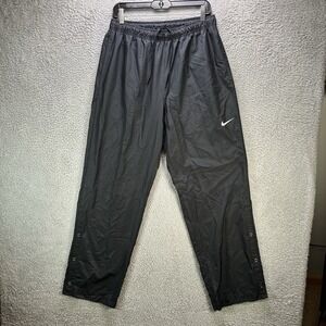 Nike Golf Rain Pants Mens Medium Black Snap Button Stretch Swoosh Windbreaker